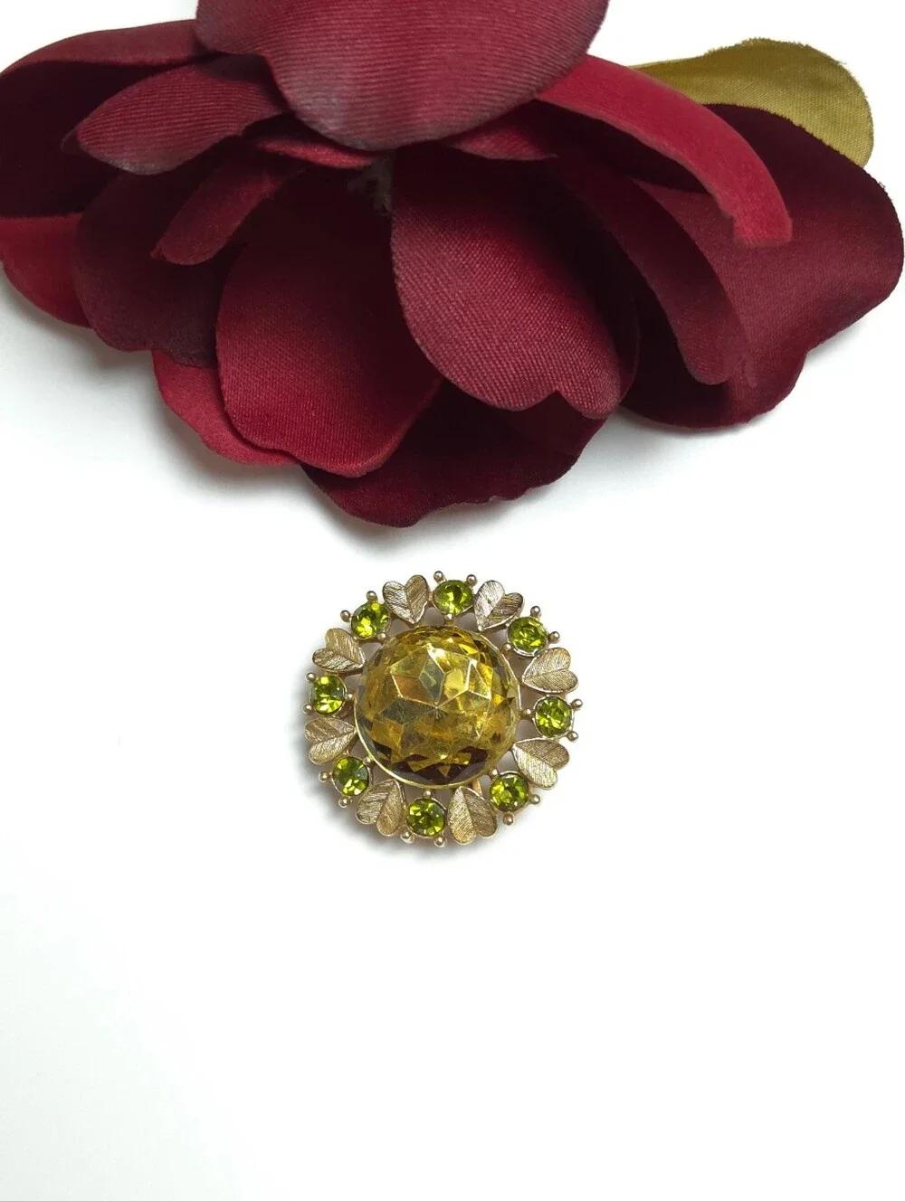 Vintage Avon 'Sun Brilliance' Green Crystal Gold Tone Brooch Pendant 1970s Avon
